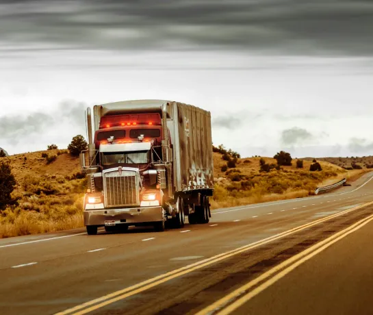 Fleet owner reviewing per-truck profit data on screen